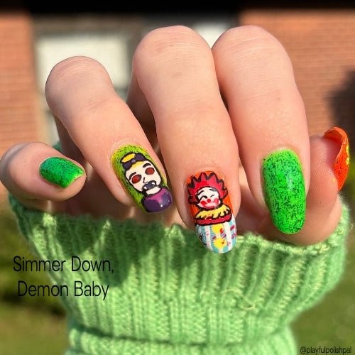 One hand swatch of Take It Down a Notch, Demon Baby, a dark neon yellow polish with black microglitter and black micro slices, including its bright green appearance under UV light. One finger has a clown painted on it and one finger has a demon baby painted on it.